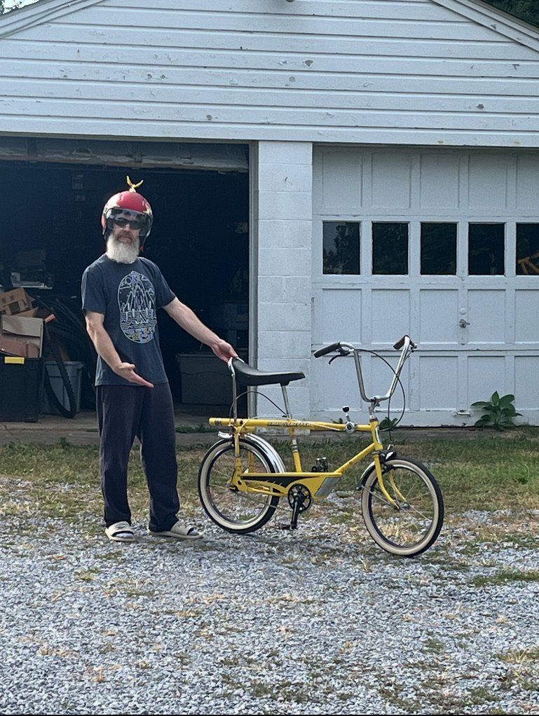Kevin Szarnicki owner of Bike 194 in Walkersville, MD with a yellow bike
